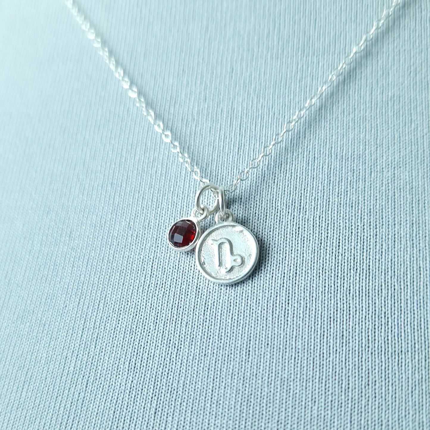 Capricorn Garnet charm necklace in sterling silver