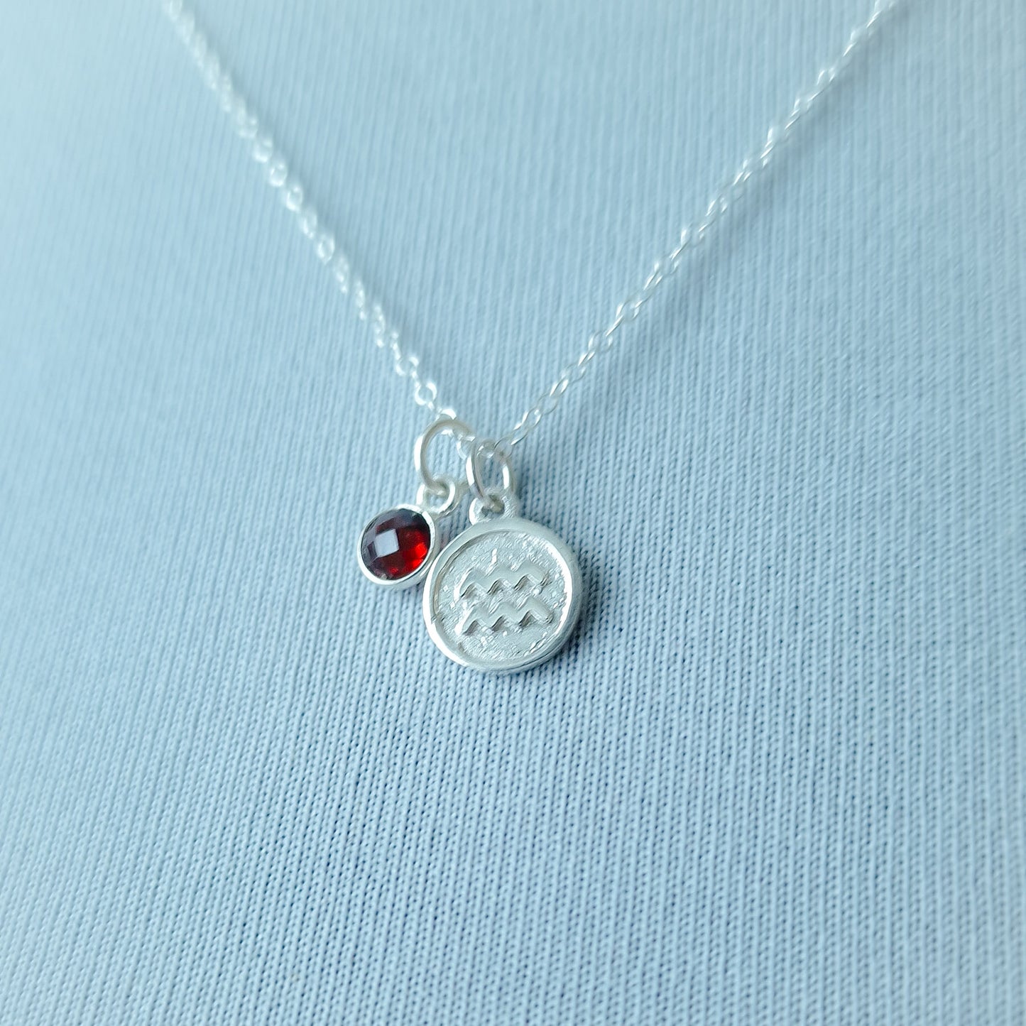Aquarius and garnet double pendant necklace in sterling silver
