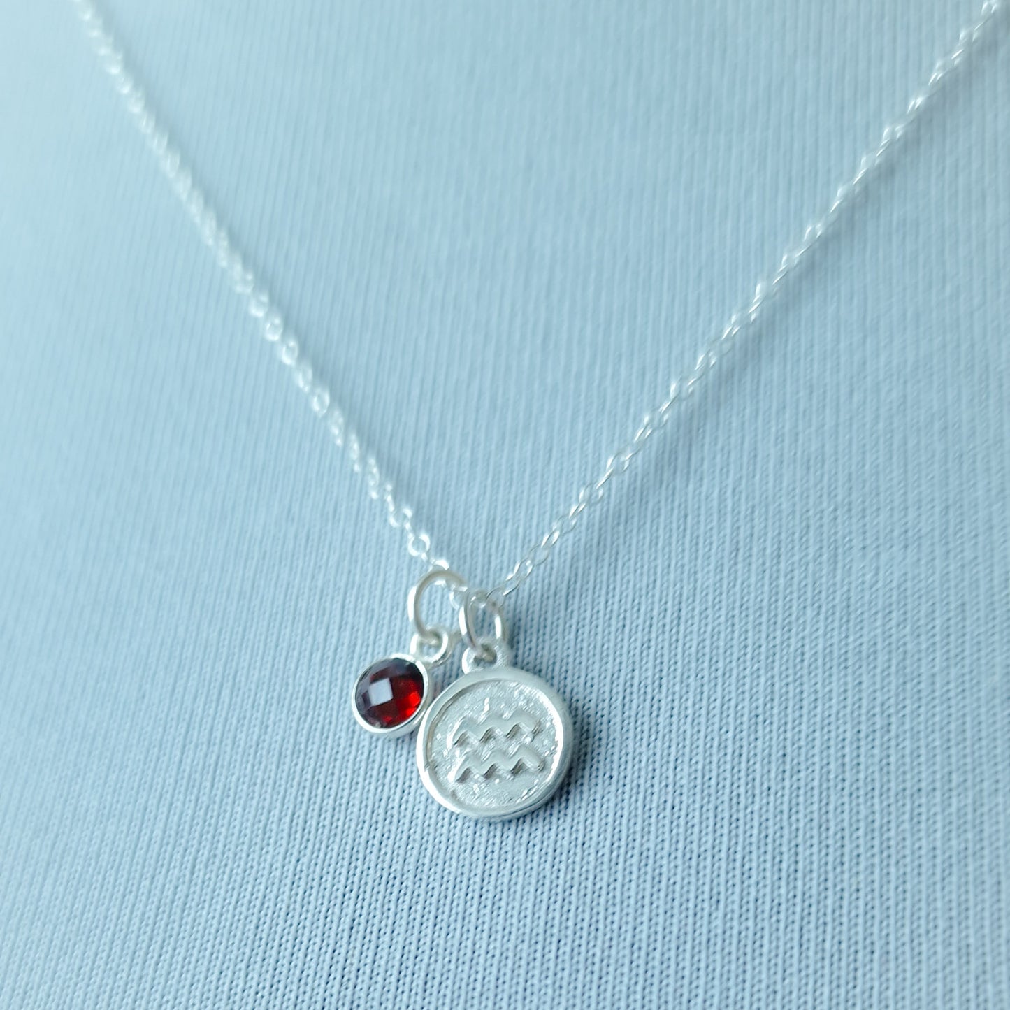 Aquarius and garnet double pendant necklace in sterling silver