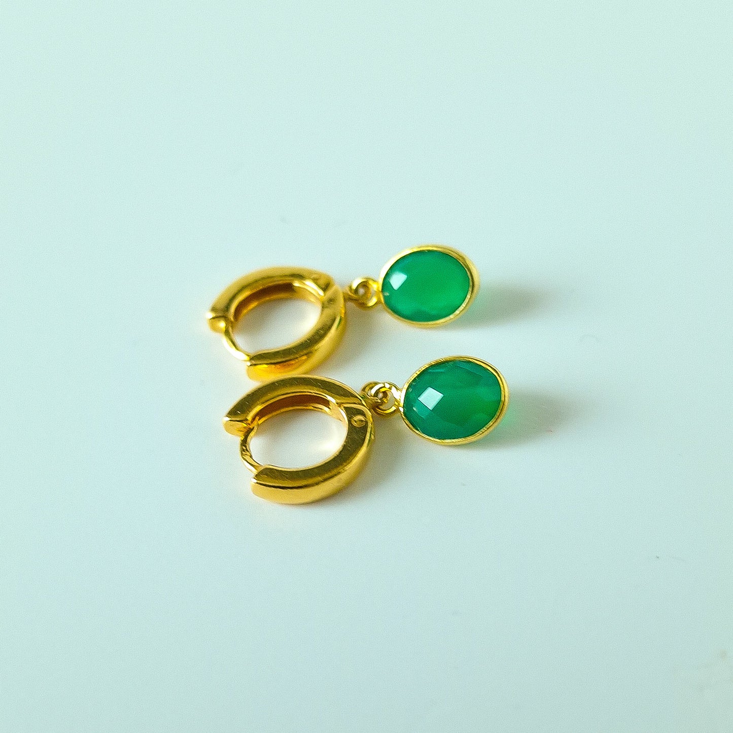 Green Onyx Huggie Hoop Earrings in Gold Vermeil Silver - dainty facetted oval green Onyx gemstones hang off gold vermeil silver huggie hoop earrings.