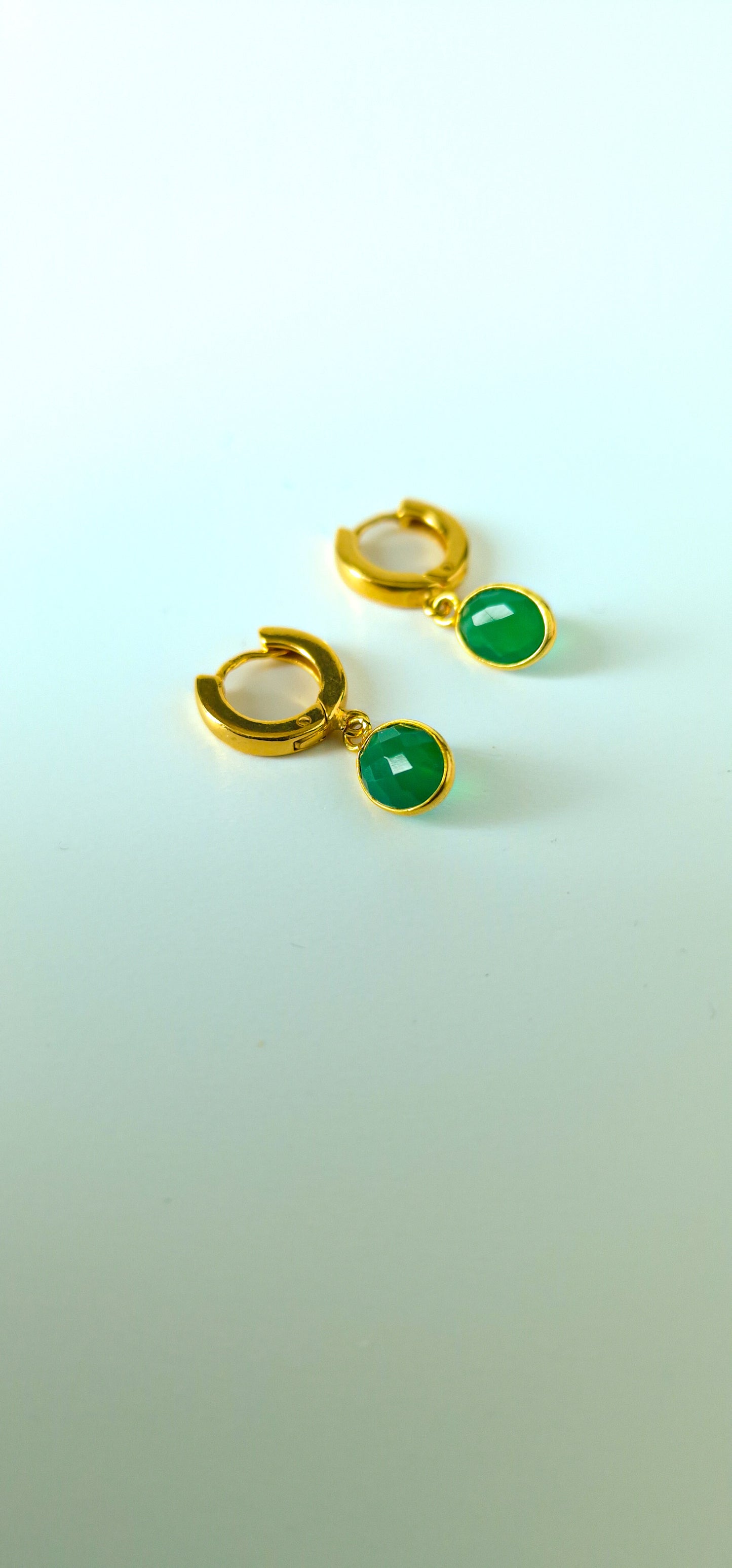 Green Onyx Huggie Hoop Earrings in Gold Vermeil Silver - dainty facetted oval green Onyx gemstones hang off gold vermeil silver huggie hoop earrings.