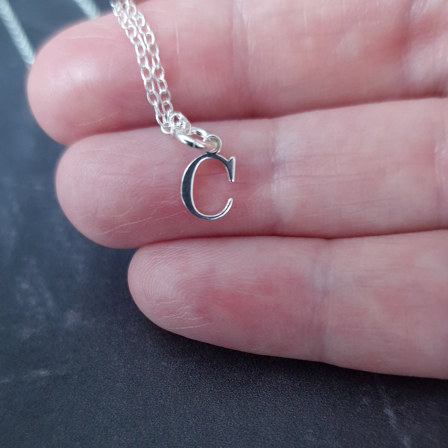 Close up of Sterling Silver Initial Alphabet Necklace