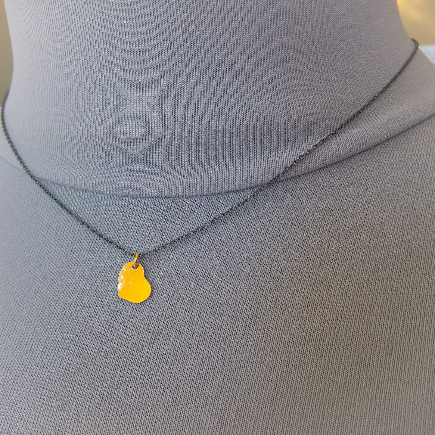 Dainty gold heart pendant on oxidized silver chain necklace
