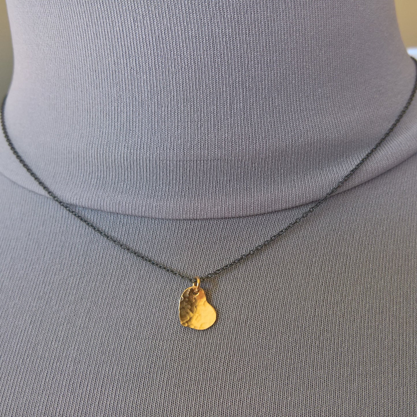 Dainty gold heart pendant on oxidized silver chain necklace