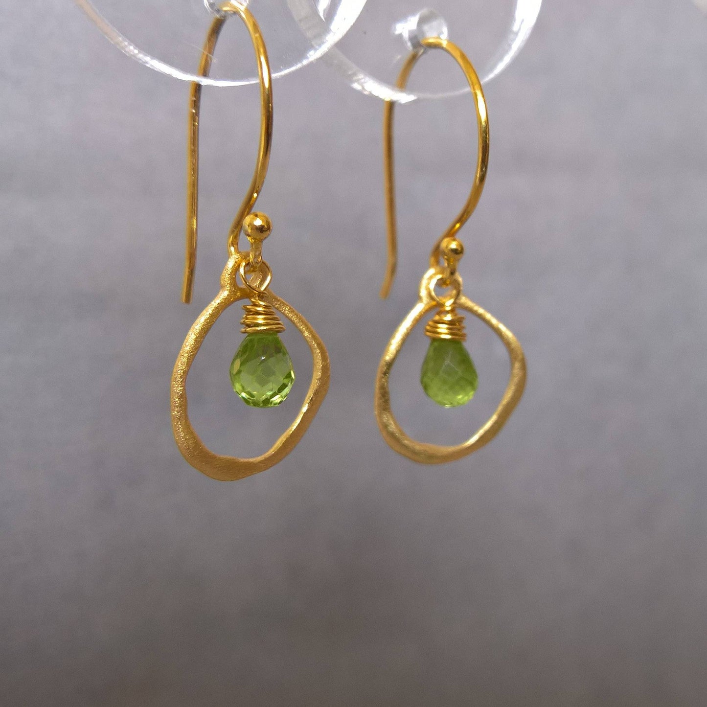 Close up of pair of peridot drop earrings - Marie Nicole Bijoux