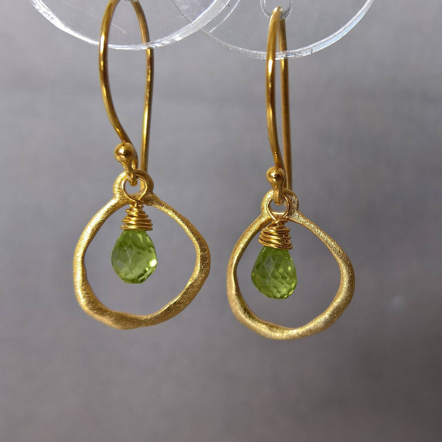 Close up of pair of peridot drop earrings - Marie Nicole Bijoux