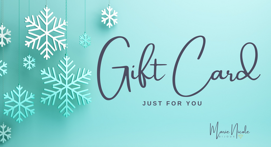 Snowflakes hanging behind a Gift Card text