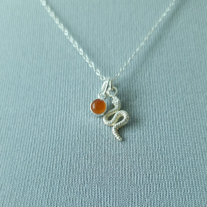 Close up of silver double pendant snake necklace with carnelian birthstone - Marie Nicole Bijoux