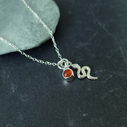 Close up of silver double pendant snake necklace with carnelian birthstone - Marie Nicole Bijoux