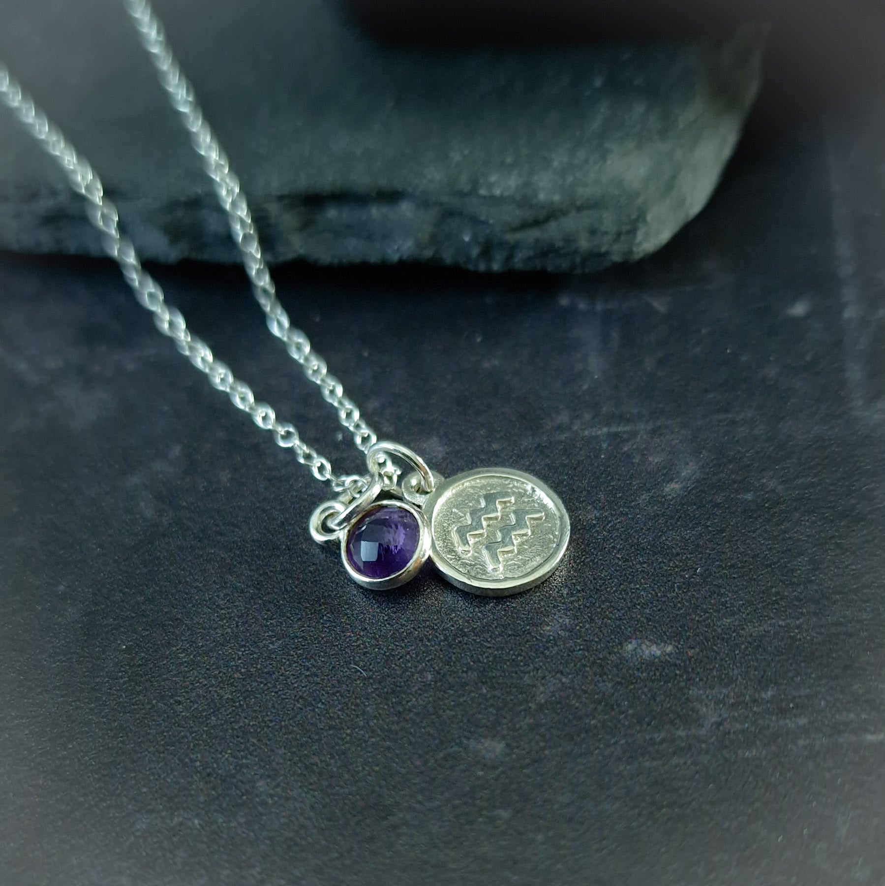 Aquarius and amethyst charm necklace in sterling silver