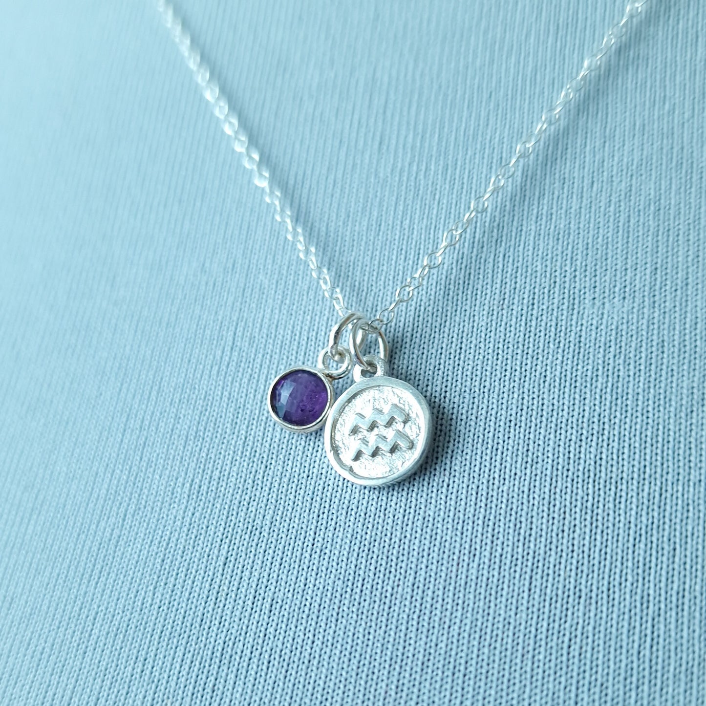 Aquarius and amethyst charm necklace in sterling silver