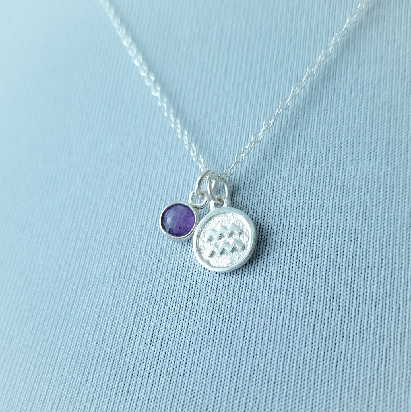 Aquarius and amethyst charm necklace in sterling silver