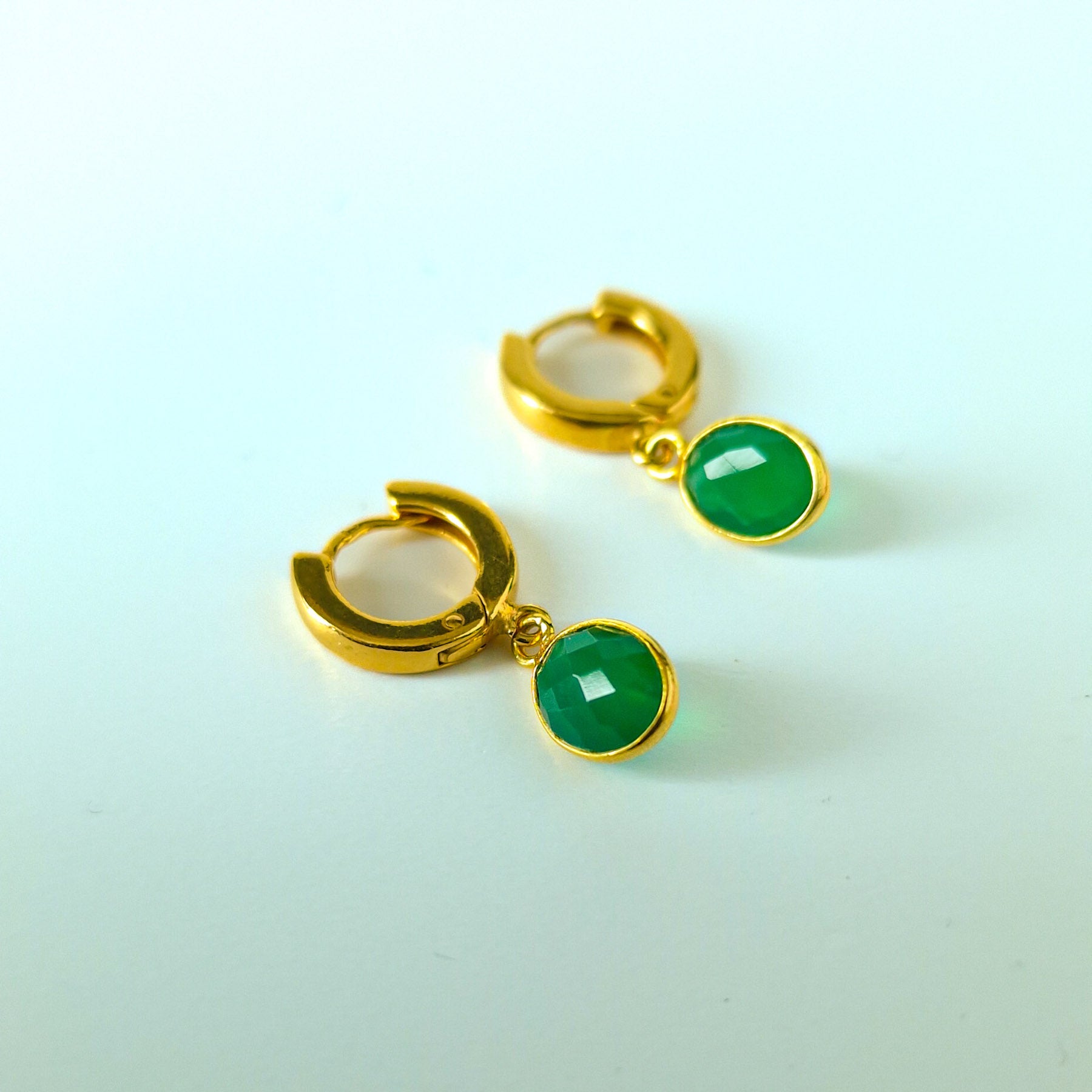 Green Onyx Huggie Hoop Earrings in Gold Vermeil Silver - dainty facetted oval green Onyx gemstones hang off gold vermeil silver huggie hoop earrings.  