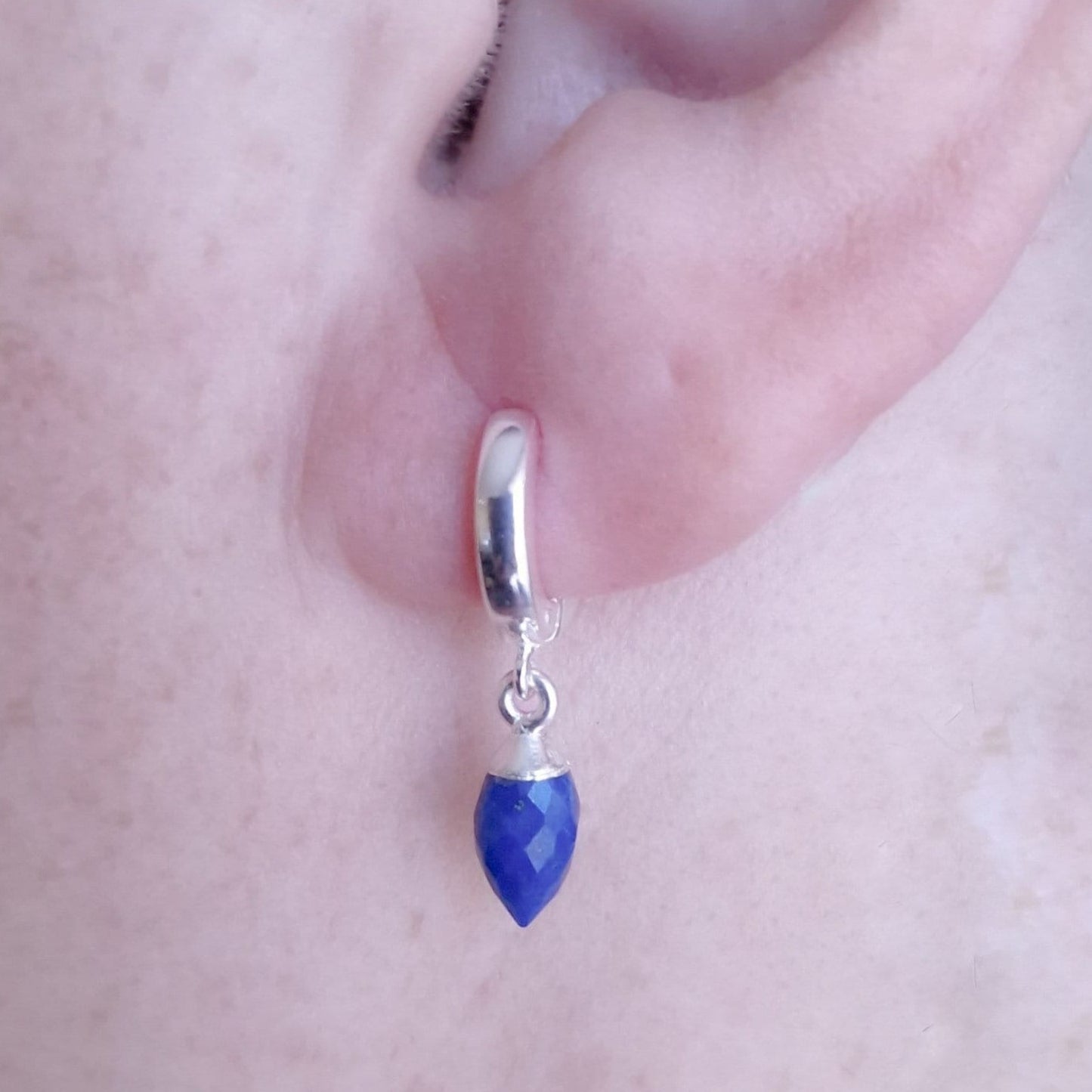 Marie Nicole Bijoux - Lapis Lazuli Marquise Silver Huggie Hoop earring - close up of earring in ear